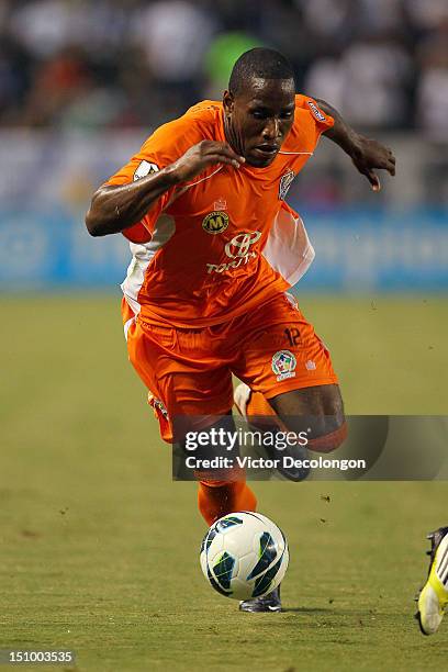 Eddie Edward of the Puerto Rico Islanders paces the ball on the attack during the group stage CONCACAF Champions League match against the Los Angeles...