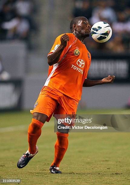 Eddie Edward of the Puerto Rico Islanders plays the ball off his chest during the group stage CONCACAF Champions League match against the Los Angeles...