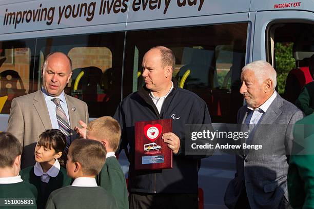 Prince Albert II of Monaco and Princess Charlene of Monaco present a Variety Children's Charity sunshine coach to pupils and staff from Greenhill...