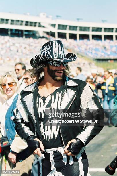 Wrestler Randy 'Macho Man' Savage cavorts on pit row, at the Charlotte Motor Speedway, Charlotte North Carolina, 1996.