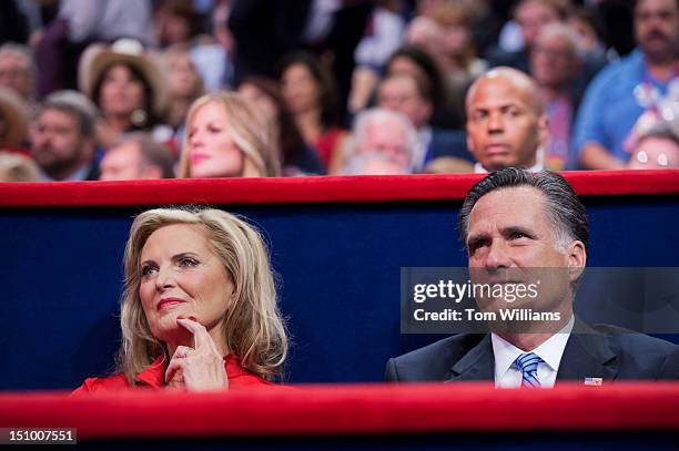 Mitt Romney, Republican presidential nominee, sits with his wife Ann, after she delivered her speech on the floor of the Republican National...