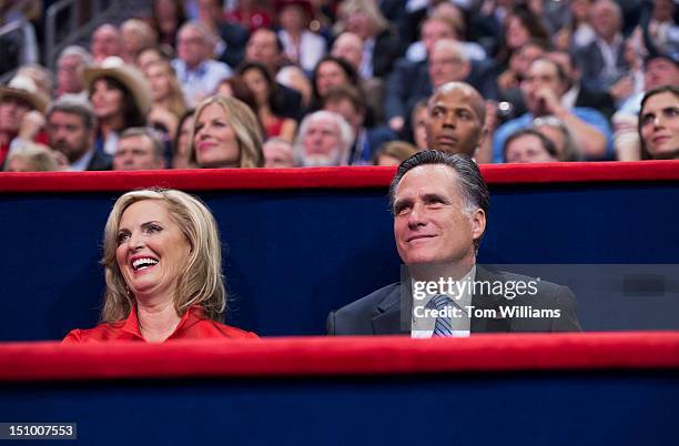 Mitt Romney, Republican presidential nominee, sits with his wife Ann, after she delivered her speech on the floor of the Republican National...