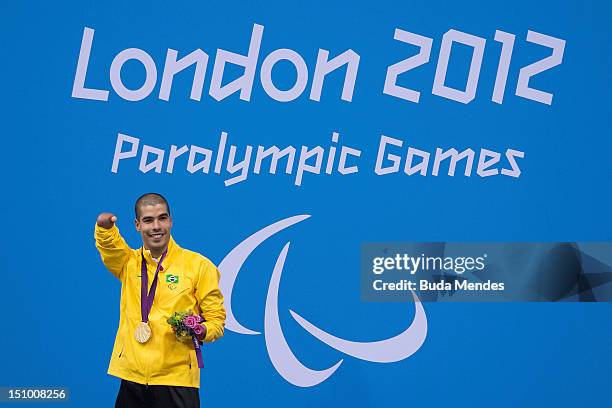 Daniel Dias of Brazil celebrates a victory and the gold medal in Men's 50m freestyle on day 1 of the London 2012 Paralympic Games at Aquatics Centre...