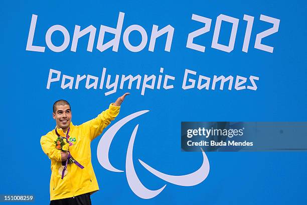 Daniel Dias of Brazil celebrates a victory and the gold medal in Men's 50m freestyle on day 1 of the London 2012 Paralympic Games at Aquatics Centre...