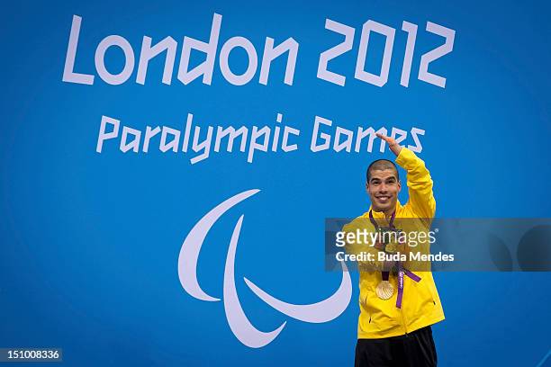 Daniel Dias of Brazil celebrates a victory and the gold medal in the Men's 50m freestyle 1 on day 1 of the London 2012 Paralympic Games at Aquatics...