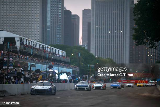 Shane Van Gisbergen, driver of the Enhance Health Chevrolet, leads the field during the NASCAR Cup Series Grant Park 220 at the Chicago Street Course...