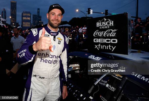 Shane Van Gisbergen, driver of the Enhance Health Chevrolet, celebrates in victory lane after winning the NASCAR Cup Series Grant Park 220 at the...