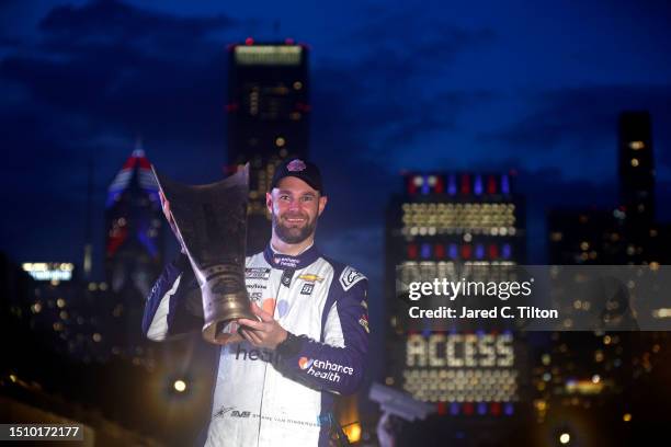 Shane Van Gisbergen, driver of the Enhance Health Chevrolet, celebrates in victory lane after winning the NASCAR Cup Series Grant Park 220 at the...