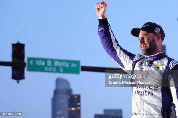 Shane Van Gisbergen, driver of the Enhance Health Chevrolet, celebrates in victory lane after winning the NASCAR Cup Series Grant Park 220 at the...