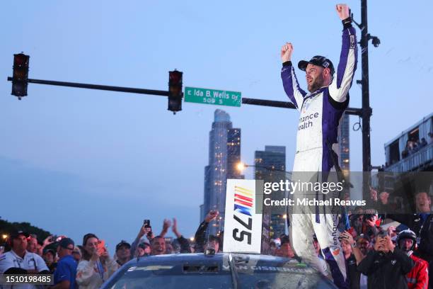 Shane Van Gisbergen, driver of the Enhance Health Chevrolet, celebrates in victory lane after winning the NASCAR Cup Series Grant Park 220 at the...