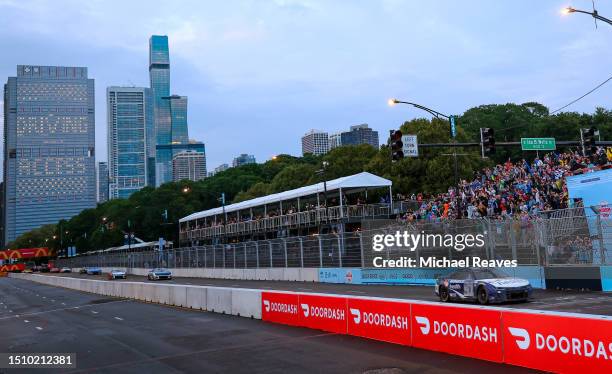 Shane Van Gisbergen, driver of the Enhance Health Chevrolet, takes the checkered flag to win the NASCAR Cup Series Grant Park 220 at the Chicago...