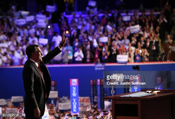 Republican presidential candidate, former Massachusetts Gov. Mitt Romney waves on stage after accepting the nomination during the final day of the...