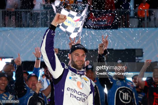 Shane Van Gisbergen, driver of the Enhance Health Chevrolet, celebrates in victory lane after winning the NASCAR Cup Series Grant Park 220 at the...