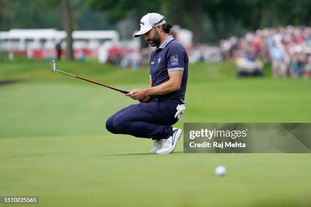 Adam Hadwin of Canada reacts after a missed putt on the 18th green during the first playoff hole during the final round of the Rocket Mortgage...