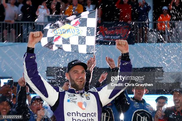 Shane Van Gisbergen, driver of the Enhance Health Chevrolet, celebrates in victory lane after winning the NASCAR Cup Series Grant Park 220 at the...