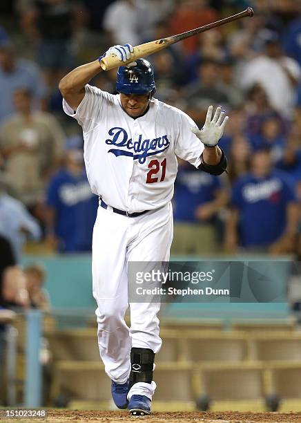 Juan Rivera of the Los Angeles Dodgers reacts after popping out with men on base for the last out of the game against the Arizona Diamondbacks on...