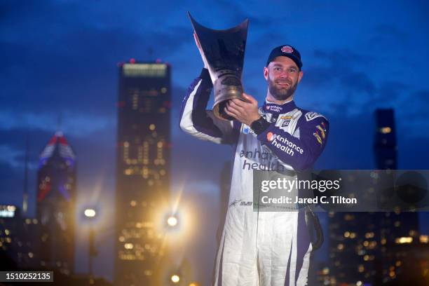 Shane Van Gisbergen, driver of the Enhance Health Chevrolet, celebrates in victory lane after winning the NASCAR Cup Series Grant Park 220 at the...