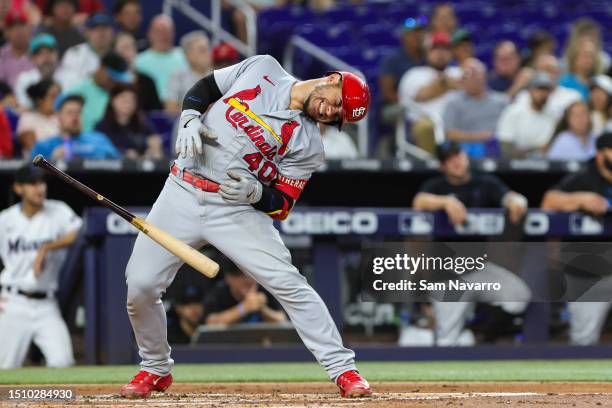 Willson Contreras of the St. Louis Cardinals is hit by pitch during the game against the Miami Marlins in the second inning at loanDepot park on July...