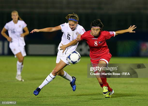 Myong Hwa Jon of Korea DPR and Morgan Brian of USA battle for the ball during the FIFA U-20 Women's World Cup Japan 2012, Quarter Final match between...