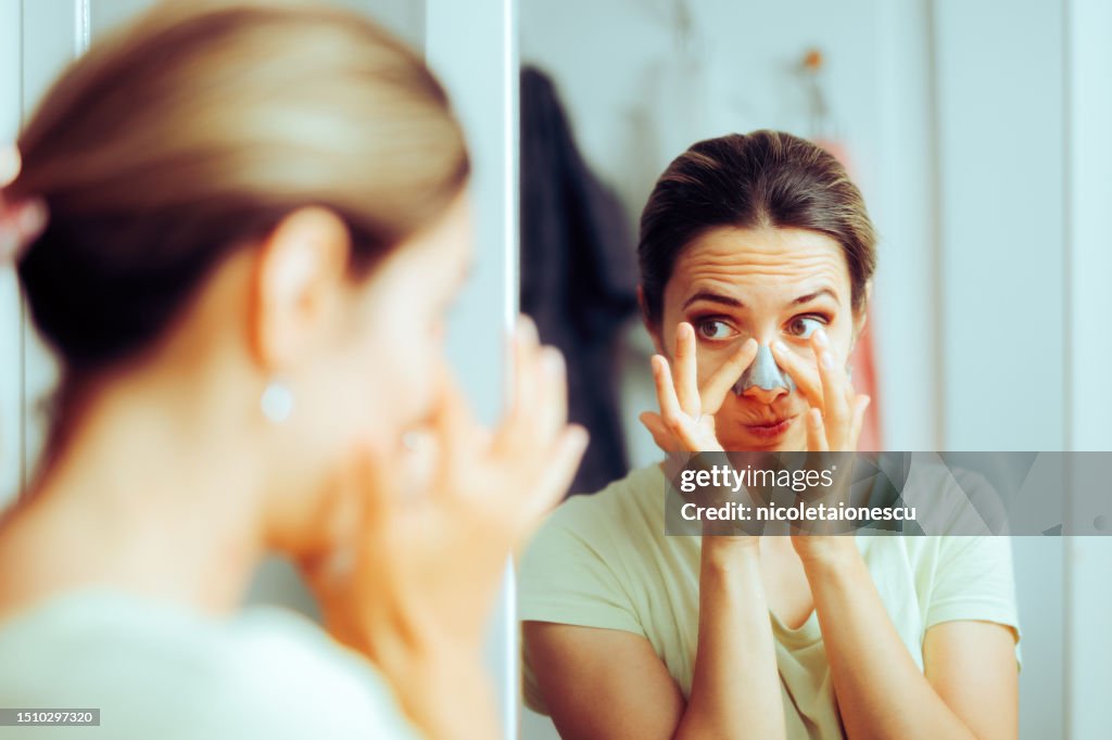 Woman Using a Deep Cleansing Pore Nasal Strip for Blackheads