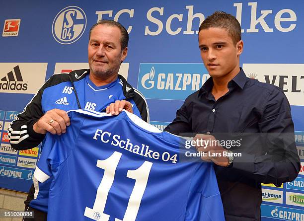 Ibrahim Afellay poses with head coach Huub Stevens after a press conference at the Veltins Arena on August 31, 2012 in Gelsenkirchen, Germany.