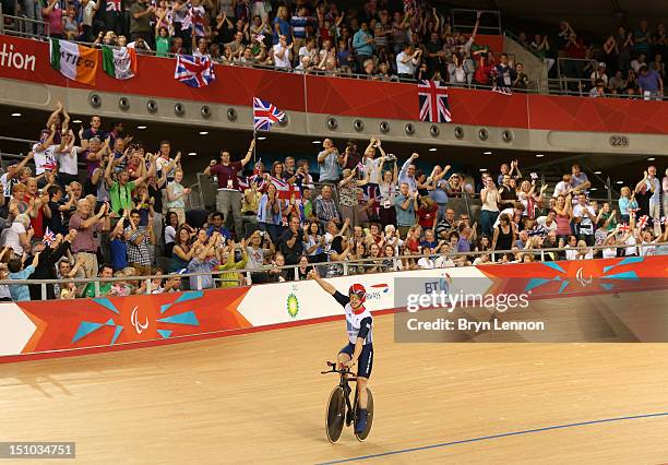 Mark Colbourne of Great Britain celebrates after setting a new world record time of 3:53.970 in the Men's Individual Cycling C1 Pursuit qualification...