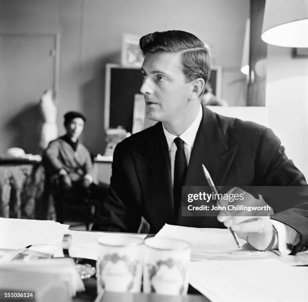 French fashion designer Hubert de Givenchy at his design house at the Plaine Monceau in Paris, 27th October 1955. Original publication: Picture Post...