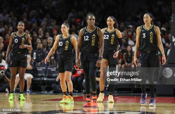 Jackie Young, Kelsey Plum, Chelsea Gray, A'ja Wilson and Candace Parker of the Las Vegas Aces walk back on the court after a timeout in the third...