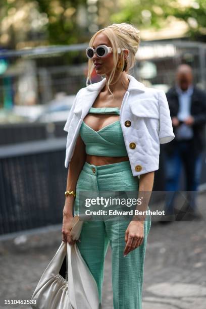 Christine Quinn wears white large circle sunglasses from Versace, a white quilted embossed pattern short sleeves / buttoned cropped short jacket, a...