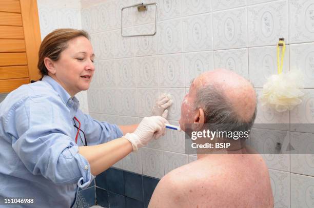 Independent Nurse, In Venissieux, France. Toilette Of A Patient Presenting An Alteration Of Mobility Motor Handicap Following A Cerebral Vascular...