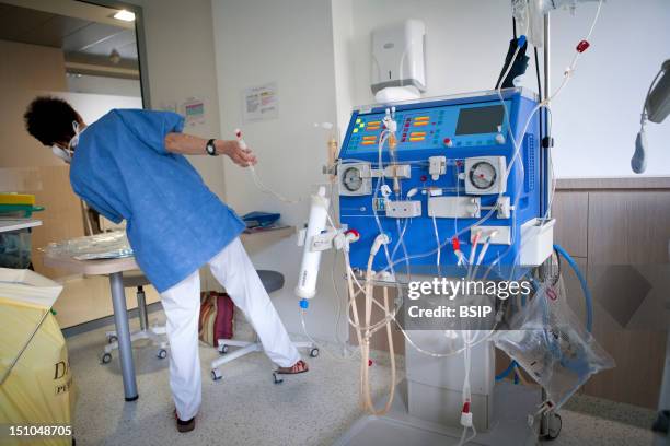 Photo Essay At The Parc Monceau International Clinic, Paris. France. Department Of Nephrology. Outpatient Hospital; Hemodialysis. Nurse With The...
