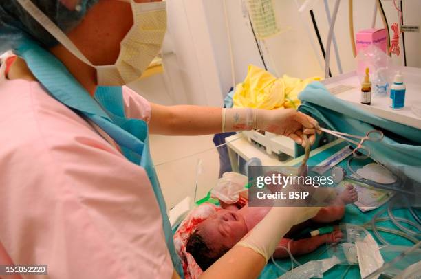 Photo Essay From Hospital. Maternity. Care Of An Asian Mixed Race Newborn Baby Boy.