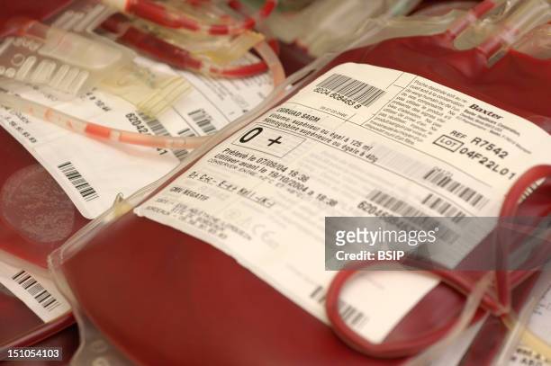 French Blood Bank In Bordeaux. Distribution Department. Entering Inventory Of Concentrated Red Cells Into Computer System. Pouches Of Red Cells With...