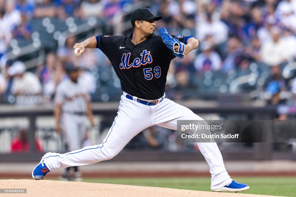 Carlos Carrasco of the New York Mets throws a pitch during the