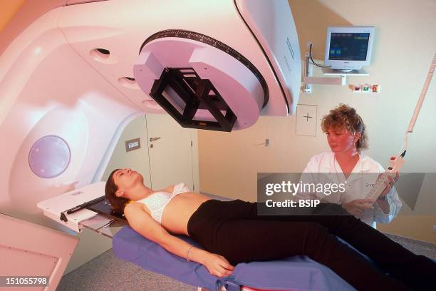 Documentary At The I. G. R. With A Technician And An Actrice. Radiotherapy For The Treatment Of Cancer, In This Case Breast Cancer. Documentary At...