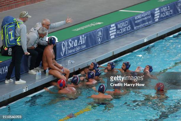 Head coach of Italy Sandro Campagna speaks to his team after a timeout in a 10-4 loss to Spain during the gold medal match in the Men's Waterpolo...
