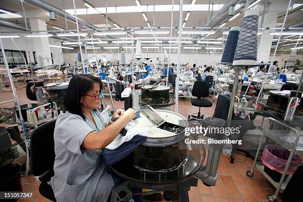 Employees work on the sewing floor of the Brunello Cucinelli SpA production facility in Solomeo, near Perugia, Italy, on Thursday, Aug. 30, 2012....