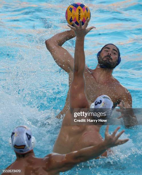 Francesco Di Fulvio of Italy attempts a shot in front of Alvaro Granados Ortega and Bernat Sanahuja of Spain in a 10-4 loss during the gold medal...