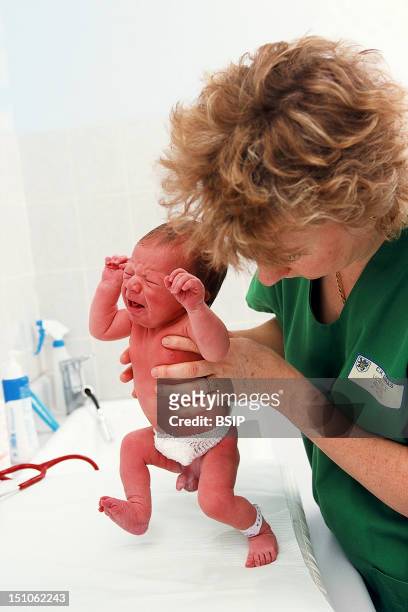 Photo Essay From Hospital. Maternity Ward Of Arras Hospital, In The Pas De Calais Department Of France. Pediatrician Testing Walking Reflex Of...