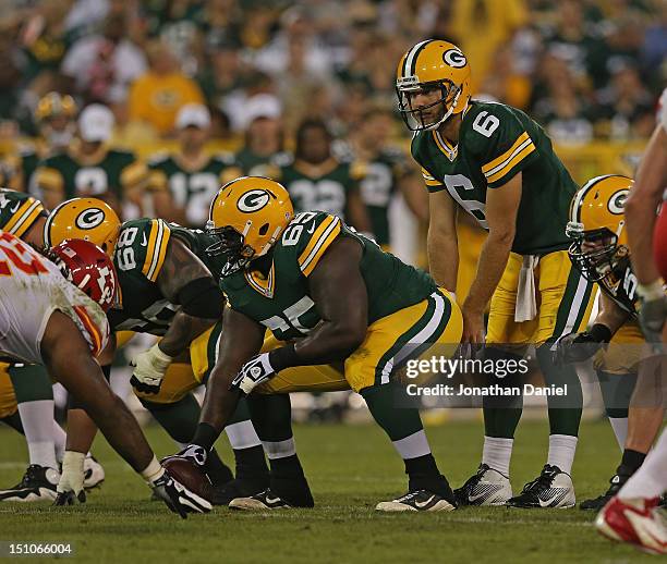 Sampson Genus of the Green Bay Packers prepares to snaps the ball to Graham Harrell against the Kansas City Chiefs during a preseason game at Lambeau...