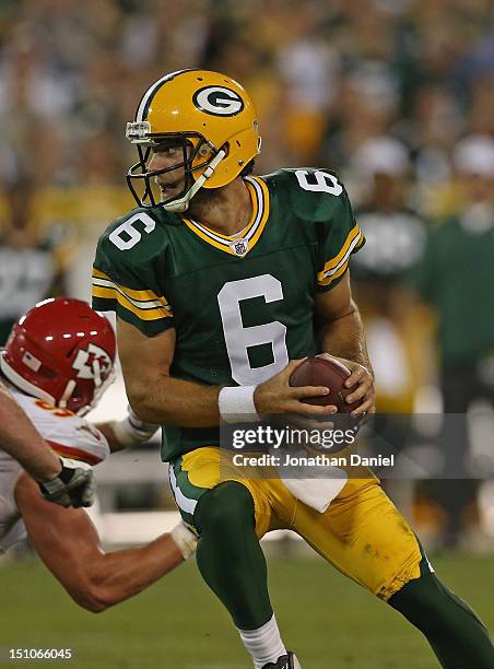 Graham Harrell of the Green Bay Packers tries to avoid the rush against the Kansas City Chiefs during a preseason game at Lambeau Field on August 30,...