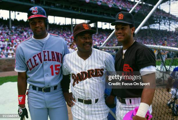 Sandy Alomar Jr. #15 of the Cleveland Indians poses with his father Sandy Alomar Sr. And brother Robero Alomar of the San Diego Padres during batting...