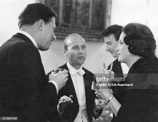 From left to right, Lord Harewood chatting with composers Hans Werner Henze, Richard Rodney Bennett and Australian violinist and fashion model...