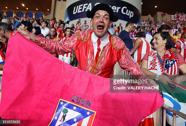 Madrid's supporter is pictured ahead of the UEFA Super Cup football match Chelsea FC versus Club Atletico Madrid, on August 31, 2012 at the Stade...