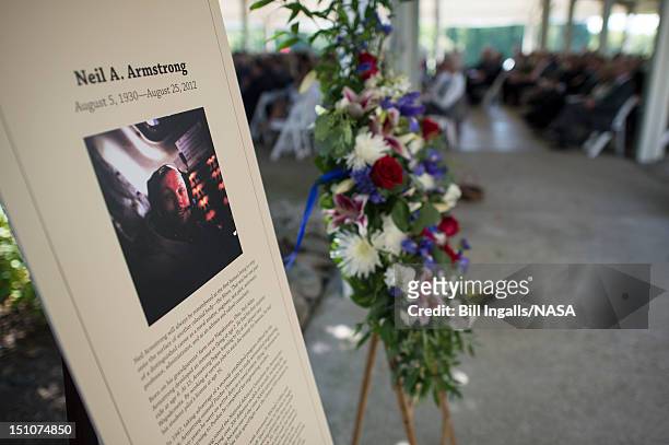 In this handout photo provided by NASA, A memorial tribute from the Smithsonian is seen at the entrance of a private memorial service celebrating the...