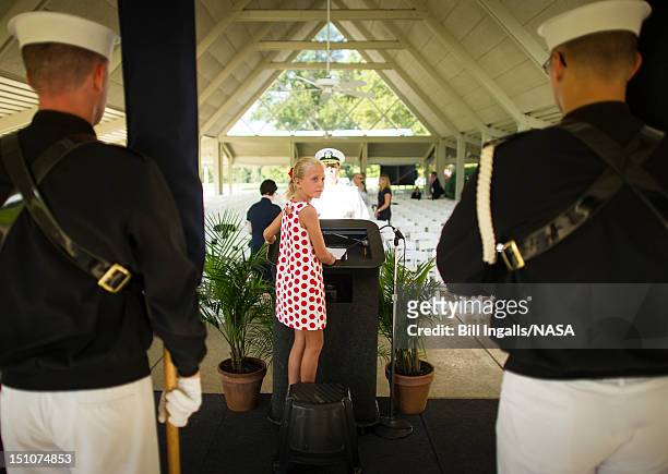 In this handout photo provided by NASA, Piper Van Wagenen, one of Neil Armstrong's 10 grandchildren, is seen during preparation of a memorial service...