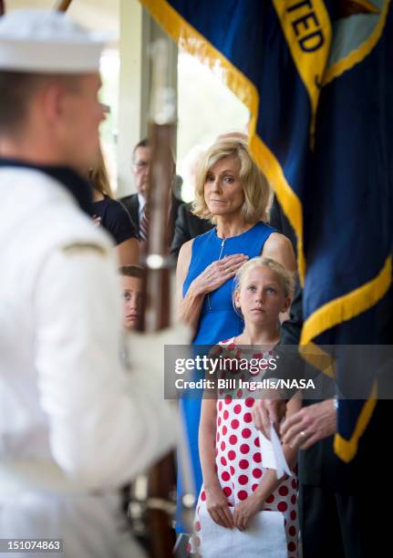 In this handout photo provided by NASA, Carol Armstrong, wife of Neil Armstrong, and Piper Van Wagenen, one of 10 grandchildren, are seen during a...