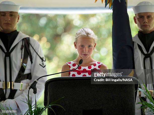 In this handout photo provided by NASA, Piper Van Wagenen, one of Neil Armstrong's 10 grandchildren, speaks during a memorial service celebrating the...