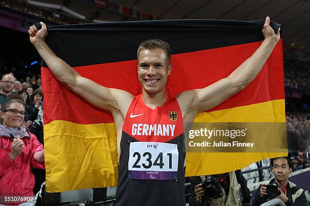 Markus Rehm of Germany celebrates winning gold in the Men's Long Jump - F42/44 Final on day 2 of the London 2012 Paralympic Games at Olympic Stadium...