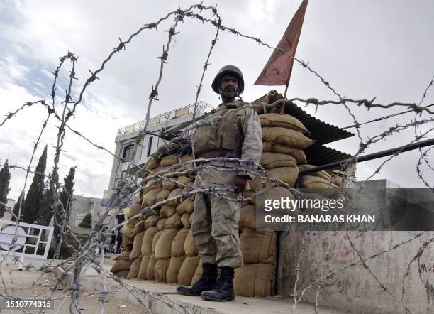 Pakistani paramilitary soldier stands alert on a roadside, a day after Pakistani President Pervez Musharraf declared a state of emergency, in Quetta,...